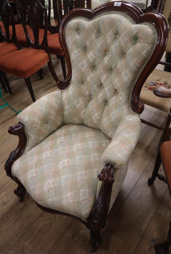 A Victorian carved mahogany framed spoonback buttoned back armchair